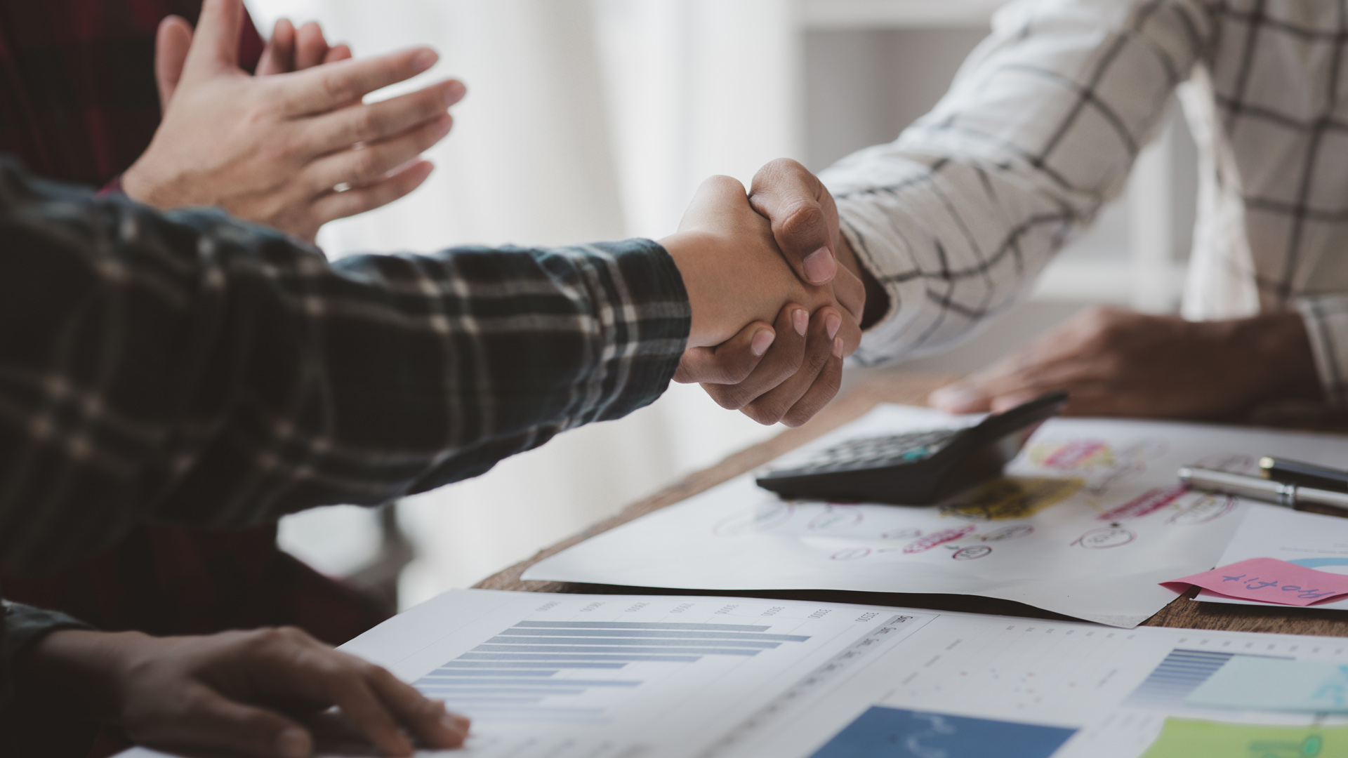 Startup founder shaking hands with an investor